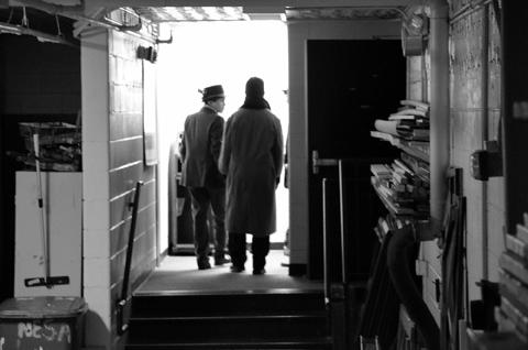 After the conclusion of the holiday orchestra and choir concert, choral members Greg Garcia 9 and Josiah Barrios 12 walk through the exit backstage.
Photo by Katherine Sotelo