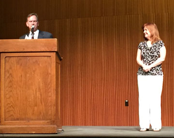 Mike Garrison, principal of Austin McCallum High School, accepts the Administrator of the Year Award at the ILPC spring convention at the University of Texas, Sunday, April 19. Looking on is TAJE executive director Rhonda Moore, who nominated him for the award.