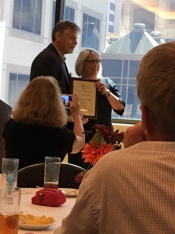 Bobby Hawthorne, Texas Journalism Guru, presents Sandy Hall Chiles with. Trailblazer Award.