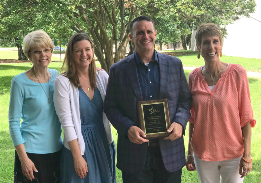 Teachers from Westlake, Cindy Todd, Alison Strelitz, Principal Steve Ramsey and Deanne Brown celebrate with Ramsey after the award ceremony.